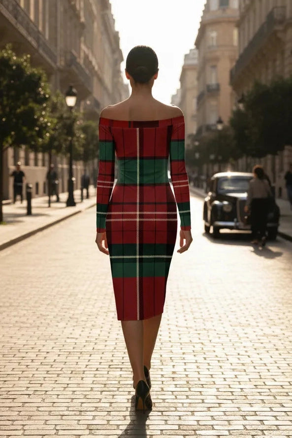 Back view of a woman wearing a burgundy green tartan off-shoulder dress walking on a city street