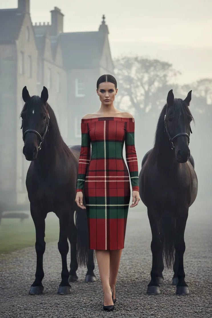 Model wearing burgundy green tartan off-shoulder dress standing between two black horses outdoors