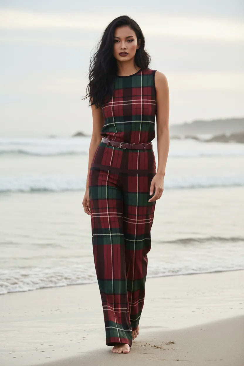 Model wearing burgundy green tartan wide leg trousers and matching sleeveless top at the beach