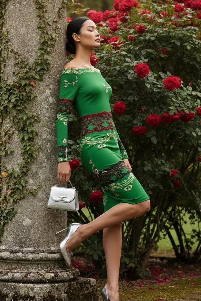 Woman wearing green baroque off shoulder midi dress by Angelic Blessings Shop posing outdoors with red roses