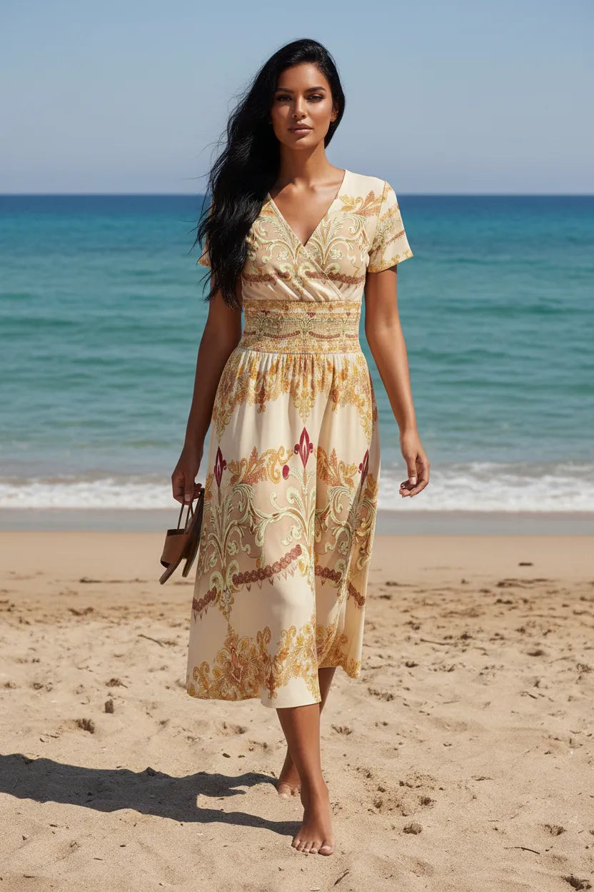 Woman wearing ivory gold v-neck midi dress walking barefoot on the beach by Angelic Blessing Shop