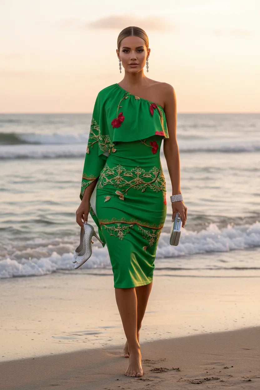 Green one-shoulder evening dress with floral embroidery worn by model walking on beach at sunset