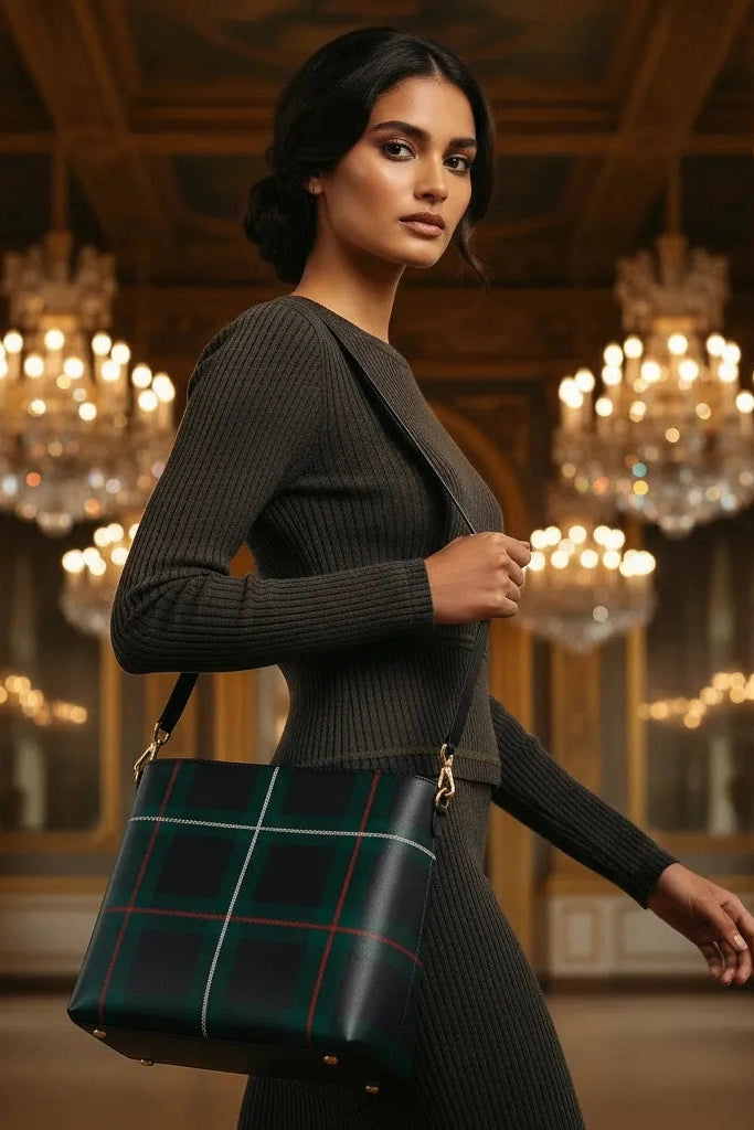 Angelic Blessings Shop old money style crossbody purse in dark green plaid worn by woman in elegant setting