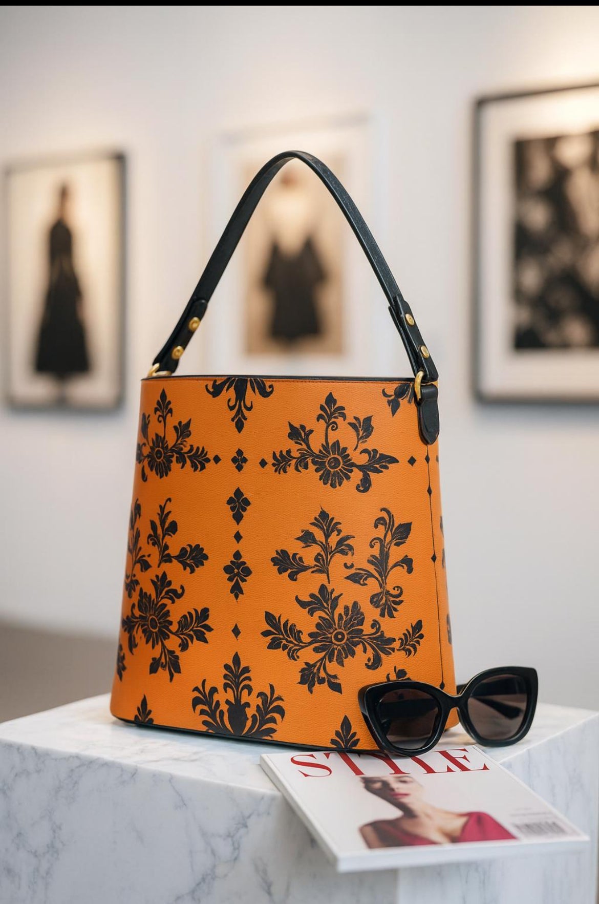 Angelic Blessings Shop orange baroque bucket bag with black floral pattern and black handle