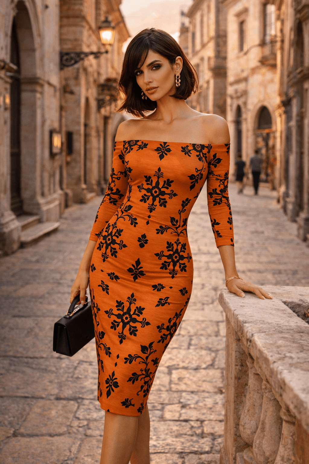 Orange and black floral bodycon midi dress with off shoulder neckline