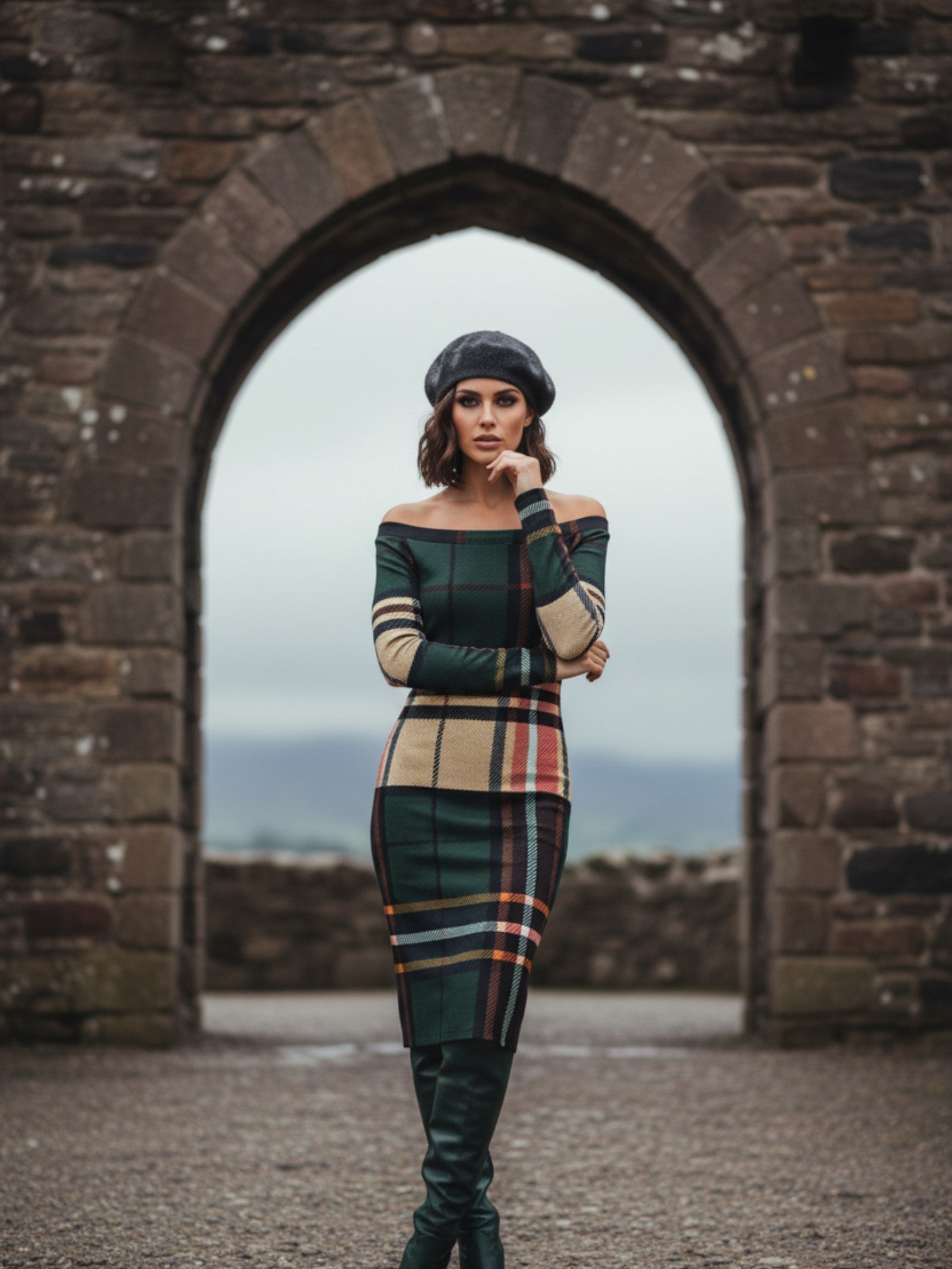 Woman wearing tartan off the shoulder midi dress with green and beige plaid pattern and black beret